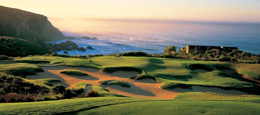Scenic view of a golf course overlooking the ocean in South Africa.